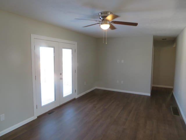 unfurnished room featuring dark hardwood / wood-style flooring, ceiling fan, french doors, and a healthy amount of sunlight