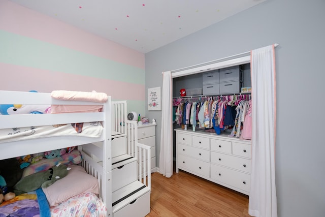 bedroom featuring a closet and light hardwood / wood-style flooring