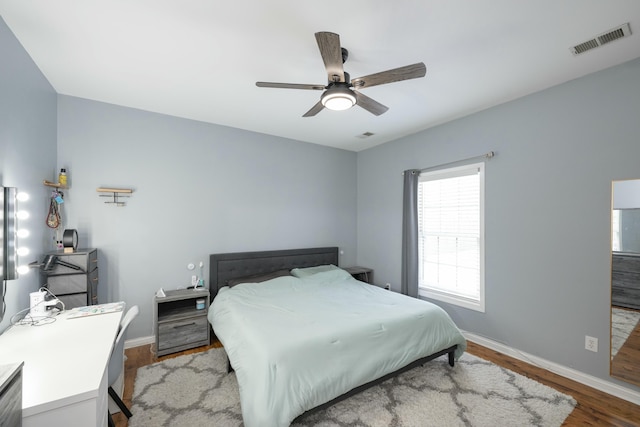 bedroom with ceiling fan and light hardwood / wood-style flooring