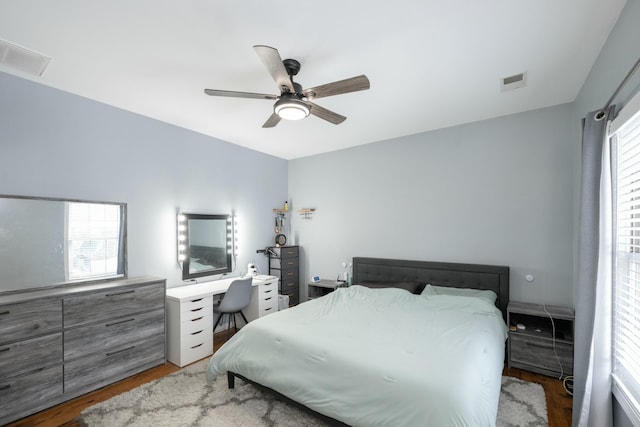 bedroom with hardwood / wood-style floors and ceiling fan