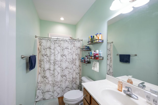 bathroom with vanity, hardwood / wood-style flooring, and toilet