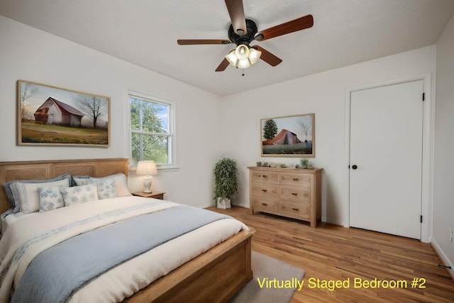 bedroom with ceiling fan and hardwood / wood-style floors