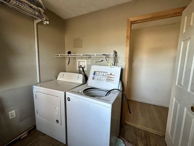 washroom featuring dark hardwood / wood-style floors and separate washer and dryer