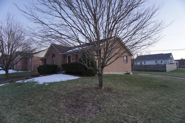 view of property exterior with a lawn