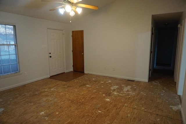 spare room featuring ceiling fan and lofted ceiling