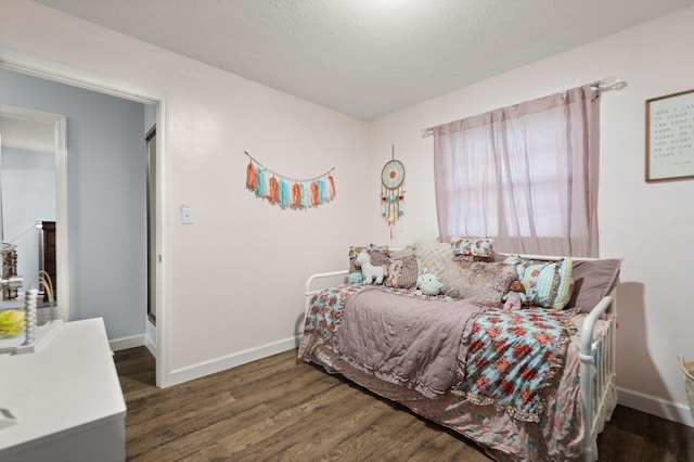 bedroom featuring dark hardwood / wood-style flooring