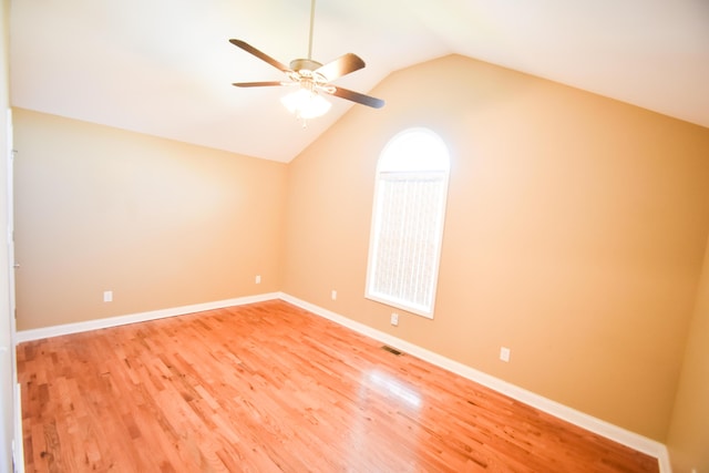 interior space featuring lofted ceiling, hardwood / wood-style floors, and ceiling fan