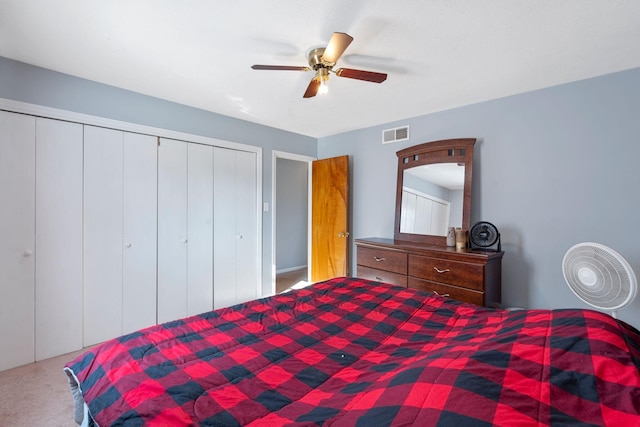 bedroom with carpet floors, ceiling fan, and a closet