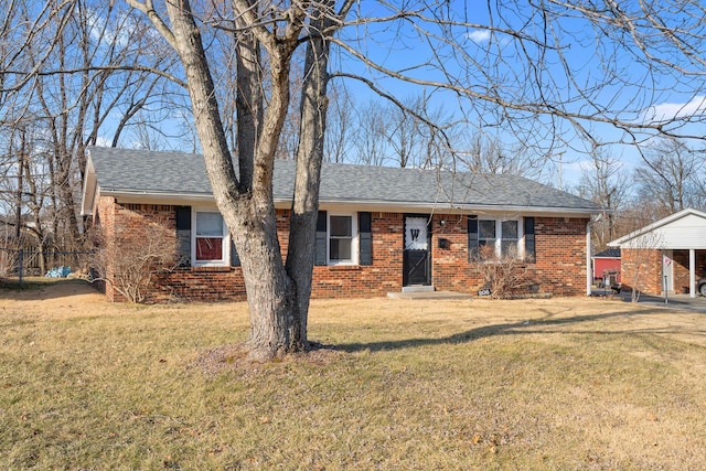 single story home with a carport and a front lawn