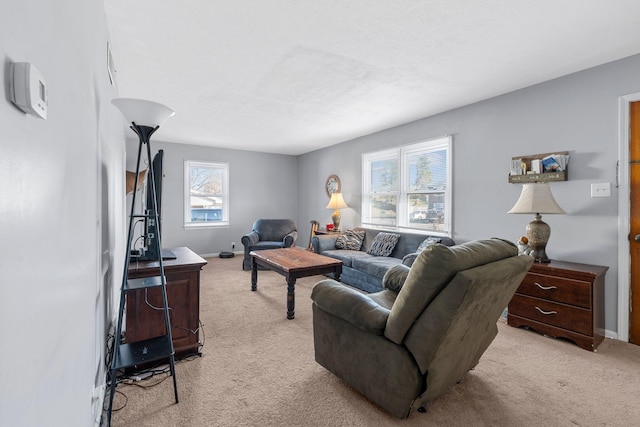 living room with light carpet and a textured ceiling