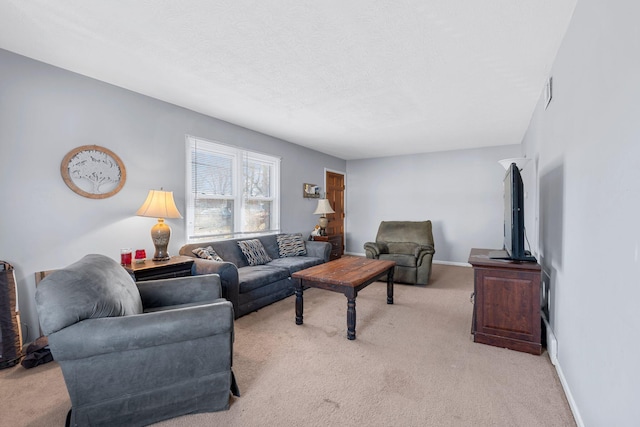 living room featuring light colored carpet and a textured ceiling