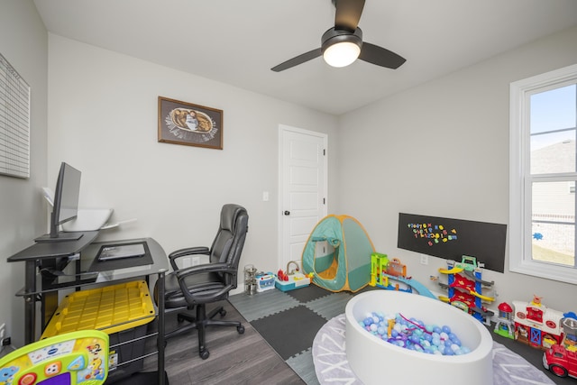 office area with dark hardwood / wood-style floors and ceiling fan