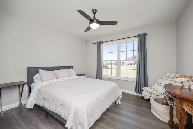 bedroom featuring dark wood-type flooring and ceiling fan