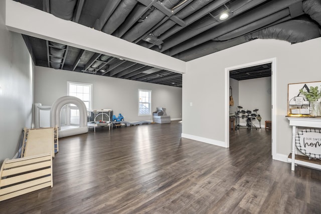 workout area featuring dark hardwood / wood-style floors