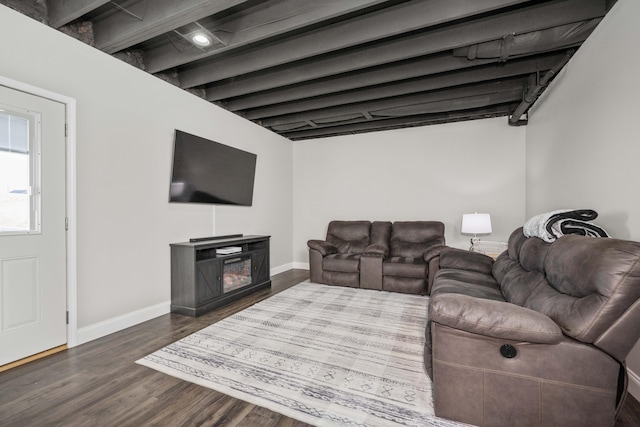 living room featuring dark wood-type flooring