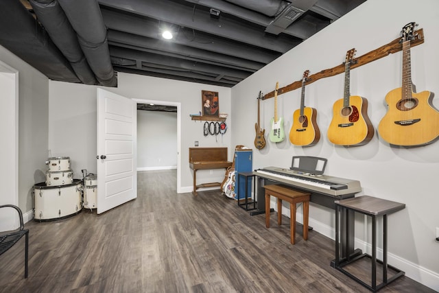 miscellaneous room with dark wood-type flooring