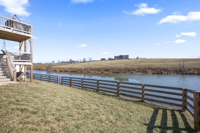 view of yard featuring a water view and a rural view