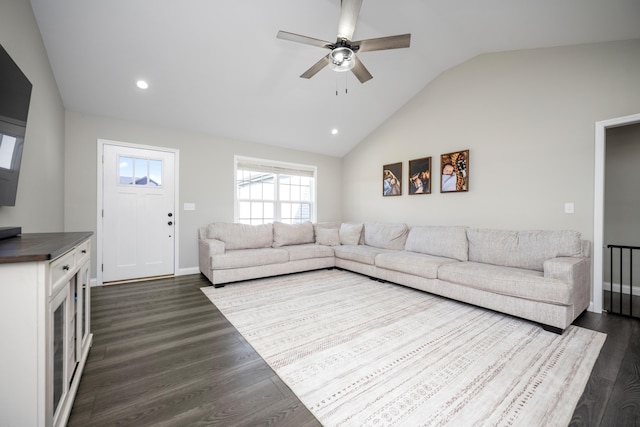 living room featuring lofted ceiling, dark hardwood / wood-style floors, and ceiling fan