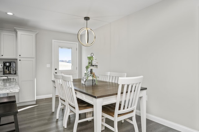 dining area with dark hardwood / wood-style floors