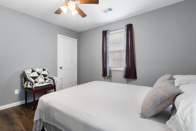 bedroom featuring dark hardwood / wood-style floors and ceiling fan