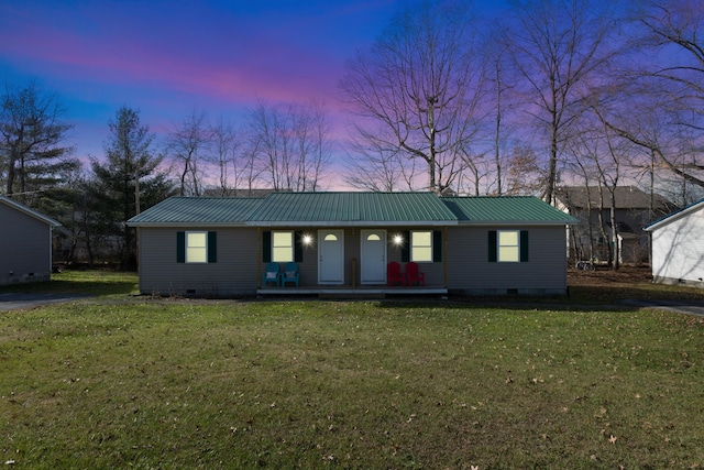 ranch-style house with a yard