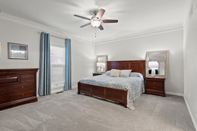 bedroom featuring light carpet, crown molding, and ceiling fan