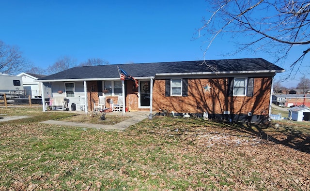 single story home with a front lawn