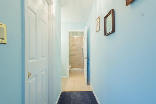 hallway with light tile patterned floors