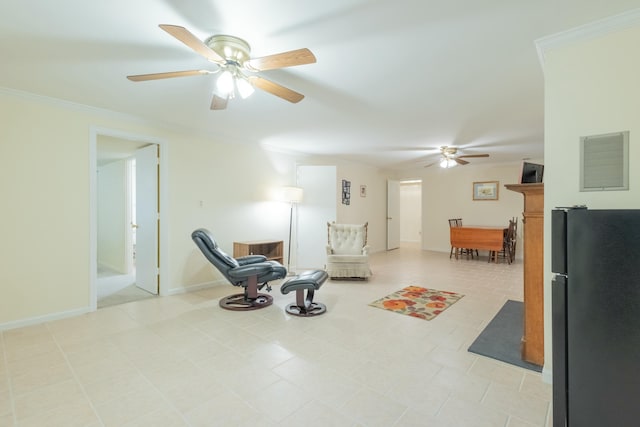 sitting room with crown molding and ceiling fan