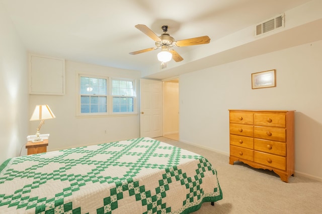 bedroom featuring light colored carpet and ceiling fan