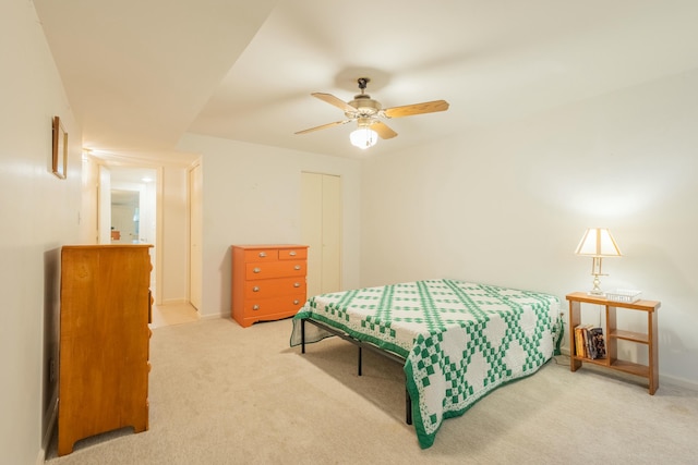 bedroom with carpet floors, a closet, and ceiling fan