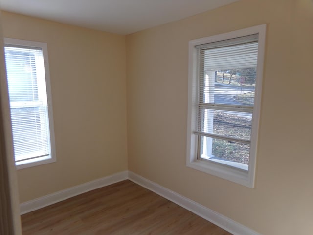 spare room with light hardwood / wood-style floors