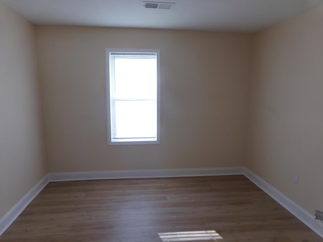 spare room featuring light hardwood / wood-style flooring