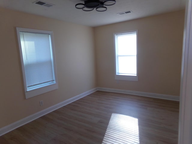 spare room with light hardwood / wood-style flooring