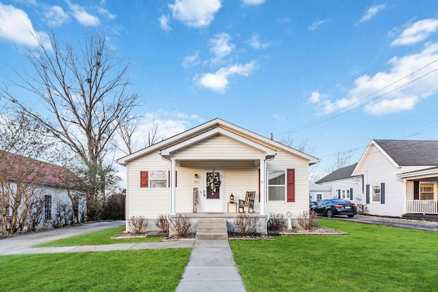 bungalow-style home featuring a front yard and a porch