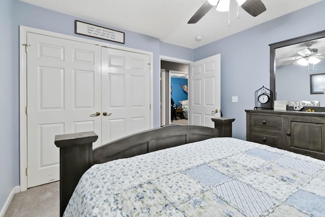 carpeted bedroom with ceiling fan and a closet