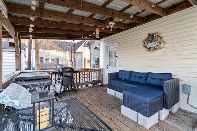 wooden deck featuring area for grilling and an outdoor hangout area