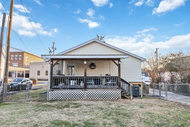 rear view of property with a porch