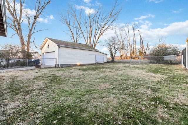 view of yard with a garage and an outdoor structure