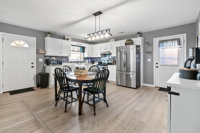 dining space featuring light hardwood / wood-style flooring