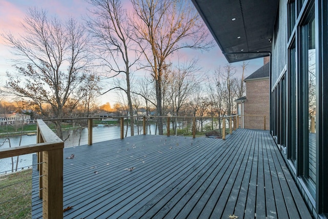 wooden deck with a water view