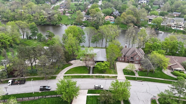 bird's eye view with a water view and a residential view