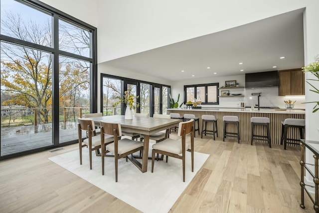 dining space featuring visible vents, recessed lighting, and light wood-style floors