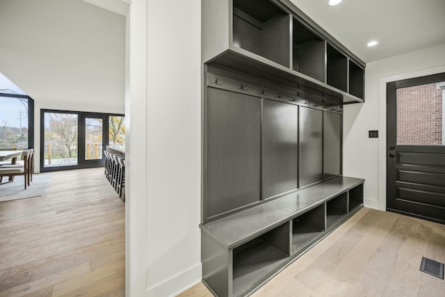 mudroom featuring baseboards, visible vents, wood finished floors, and recessed lighting