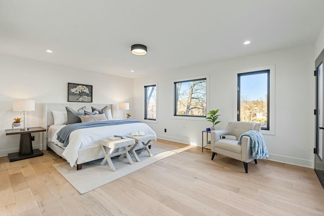 bedroom featuring baseboards, recessed lighting, and light wood-style floors