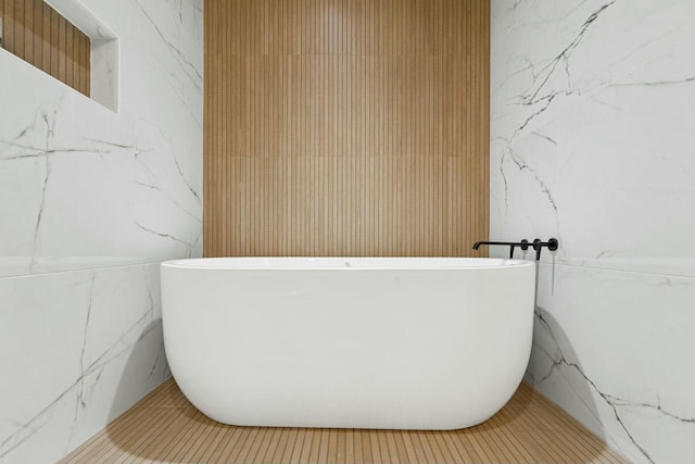 bathroom with a freestanding tub