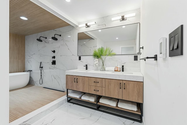 bathroom featuring a sink, a freestanding tub, a marble finish shower, marble finish floor, and double vanity