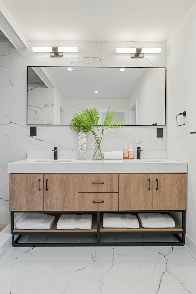 full bathroom with tasteful backsplash, double vanity, and marble finish floor