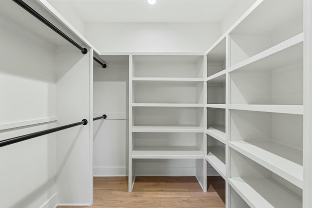 spacious closet with wood finished floors