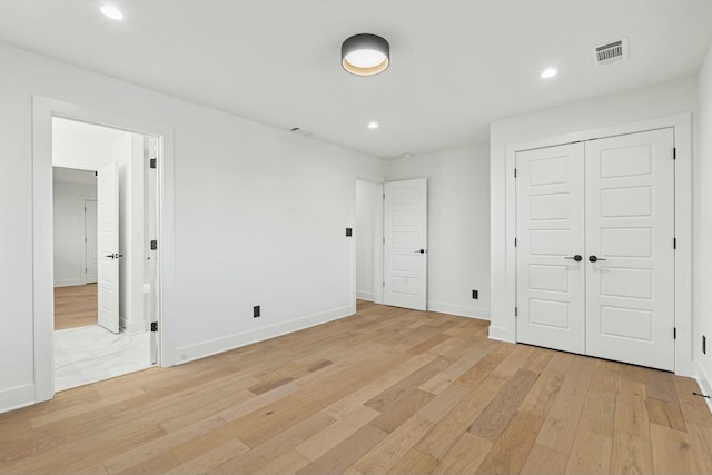 unfurnished bedroom with recessed lighting, visible vents, and light wood-style flooring